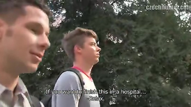 Two guys sucking the cameraman's hard cock in the park