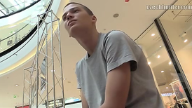 Young guy gets out of the car with the pants slid down