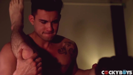 Ricky Roman is holding Zak Bishop's legs and fucking his ass