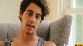 Young boy is sitting in the armchair and getting masturbated