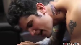 Tattooed guy Ben Rose fucks Pierre Fitch doggy on the leather sofa