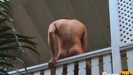 Naked boy masturbates and reaches orgasm on the balcony